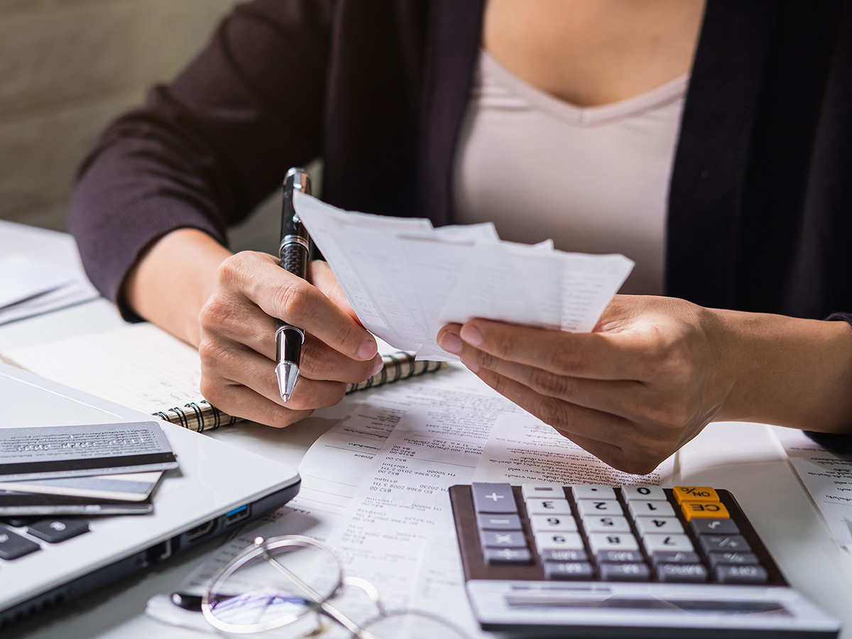 Image of a woman working on expenses