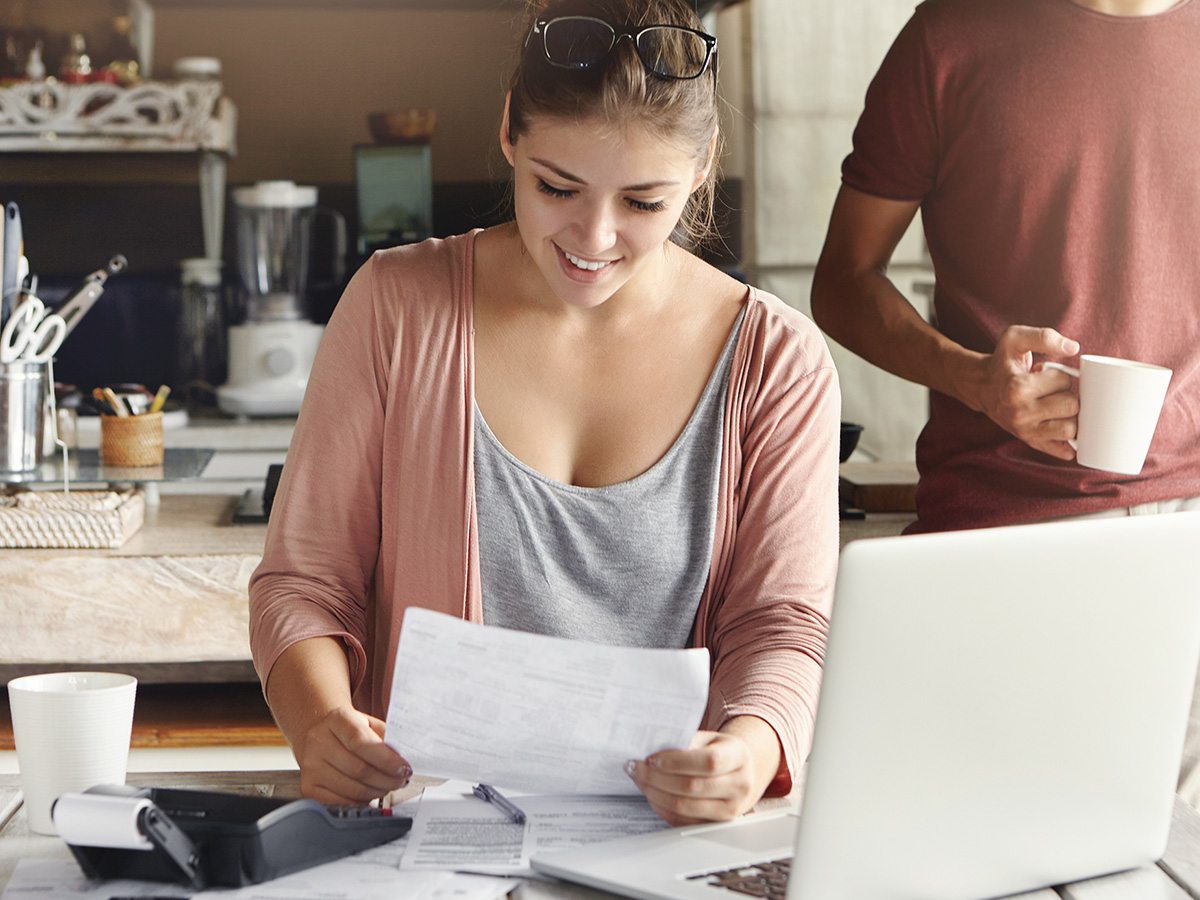 image of a woman looking at tax documents