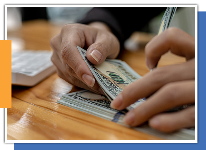 Image of a person holding money