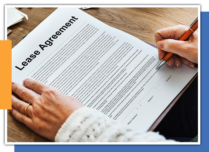 Image of a person looking at a lease agreement