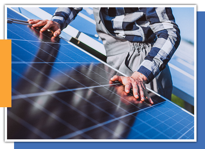 Image of a man inspecting a solar panel