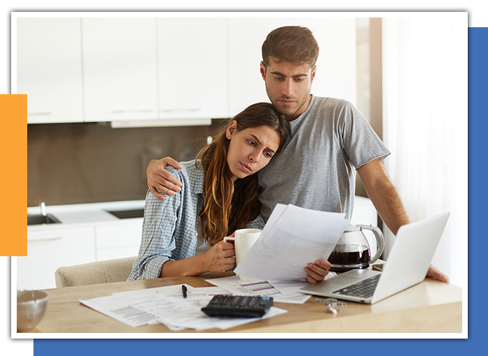 Image of a couple looking at tax forms