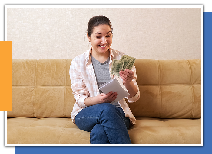 image of a woman with cash from selling solar
