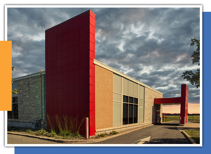 Image of a commercial building and a cloudy sky
