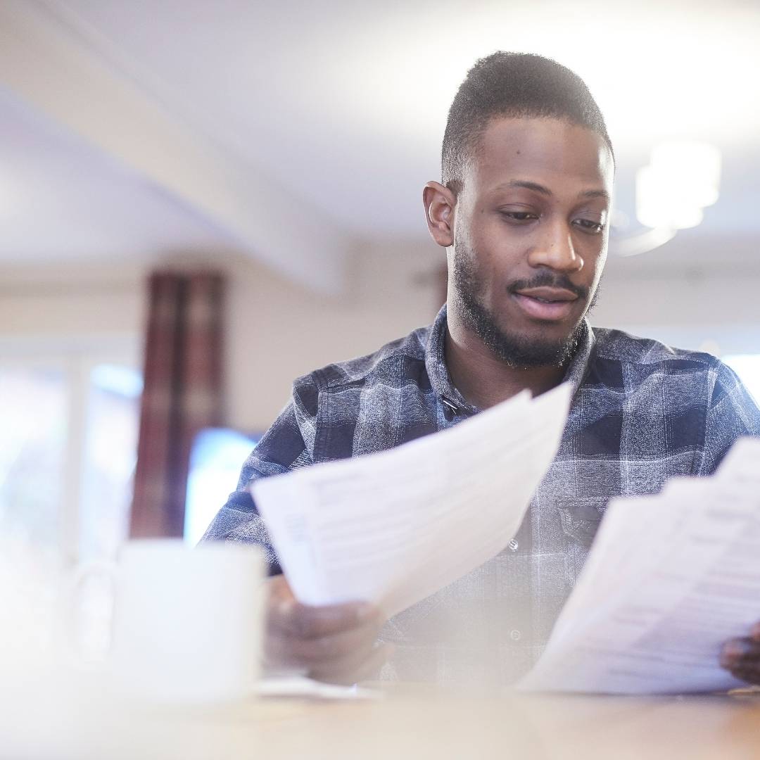 A man sorting through documents