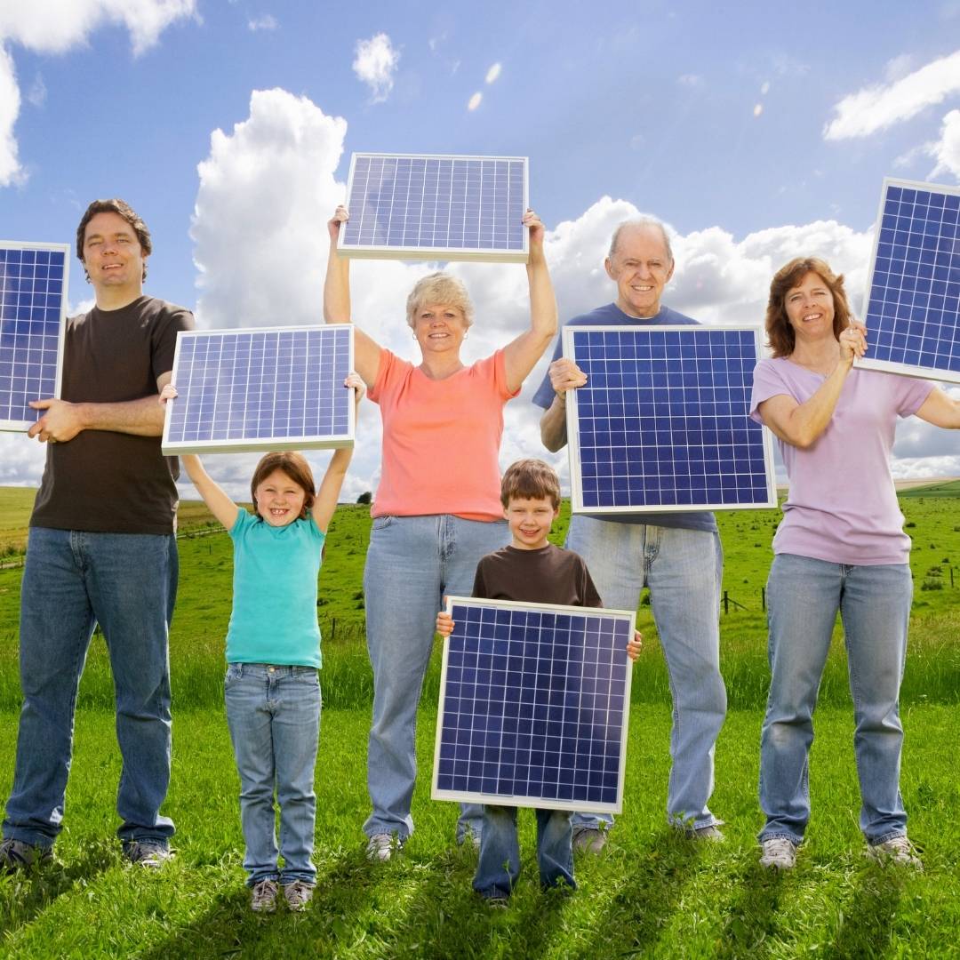 A family holding small solar panels