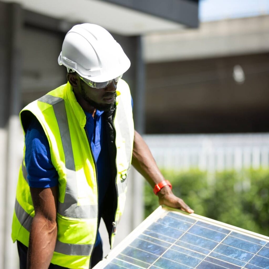 Man handling a solar panel