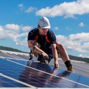 Solar panel installer at work