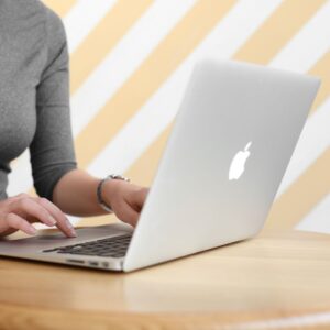 a person on an apple laptop