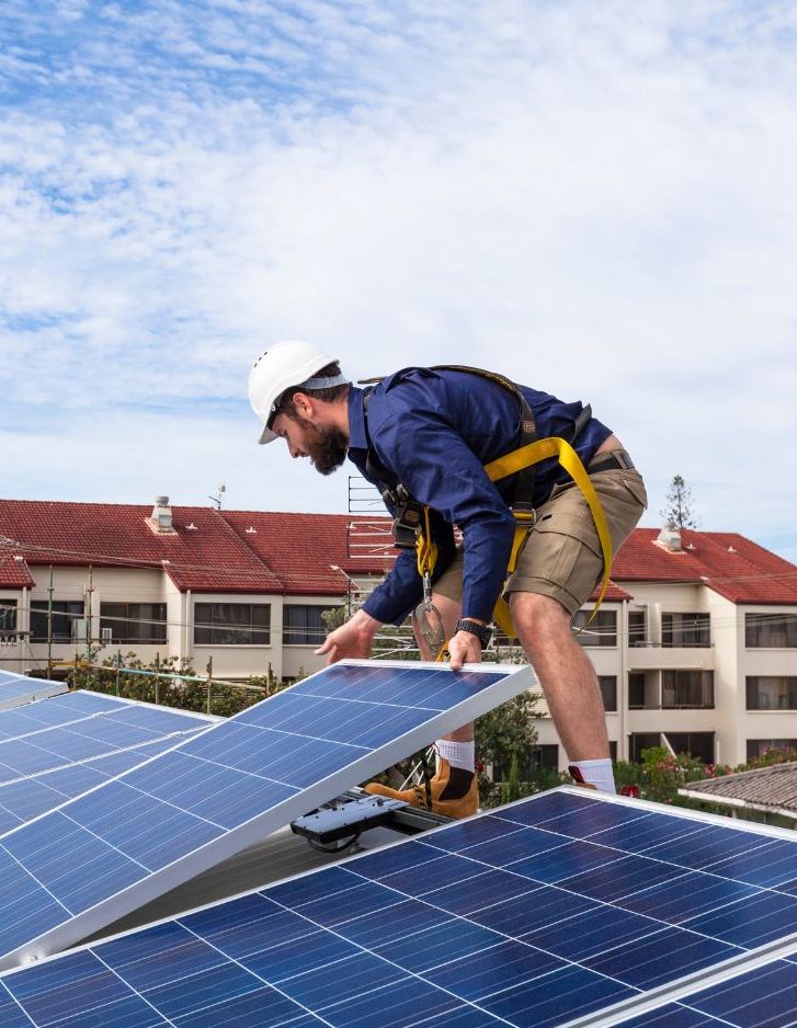 Technician installing solar panels