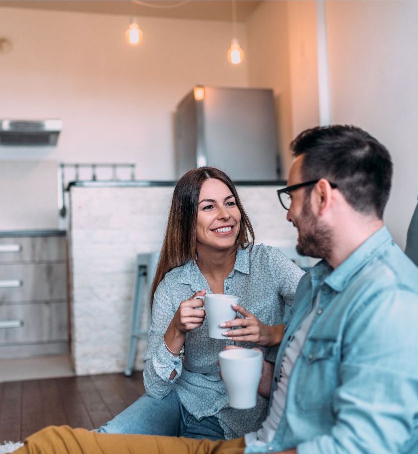 Couple having coffee at home