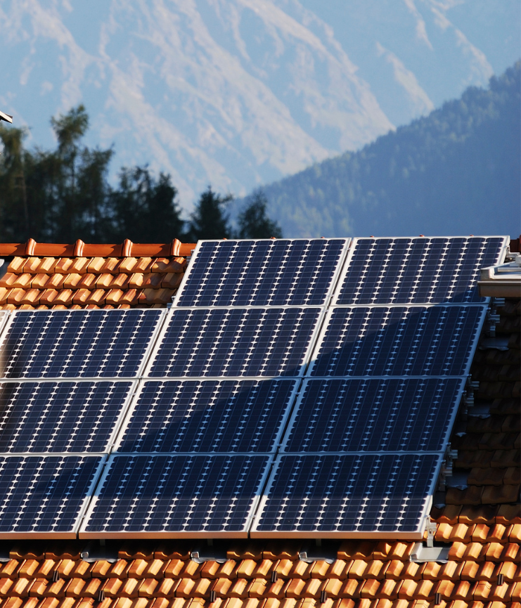 solar panels on roof with mountains
