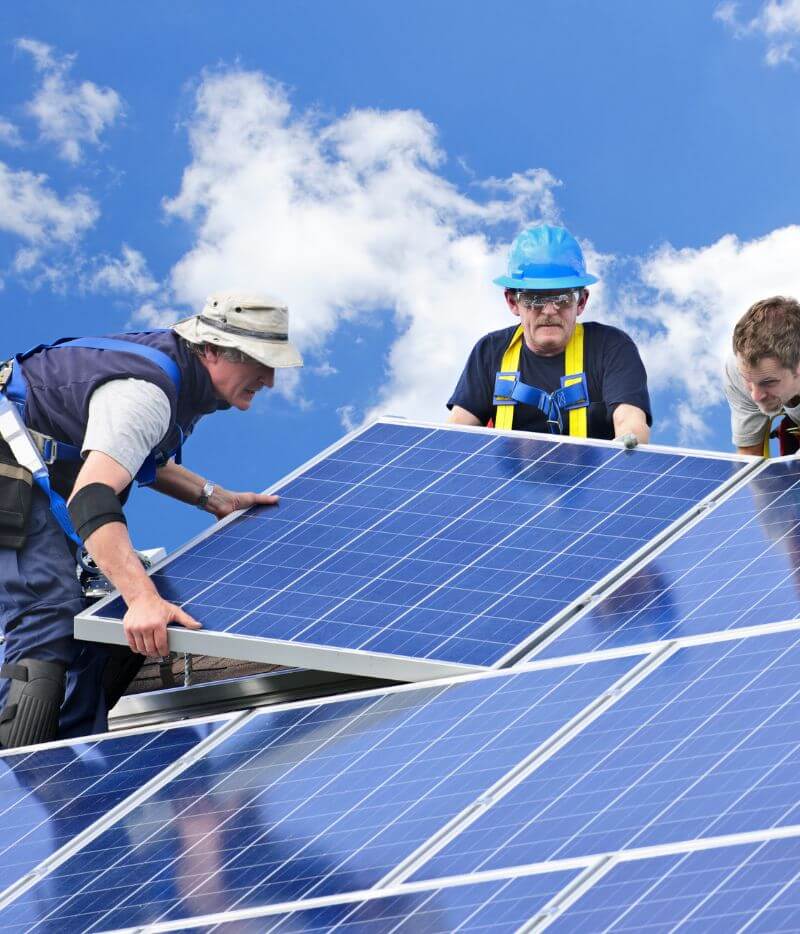 technicians installing solar panels