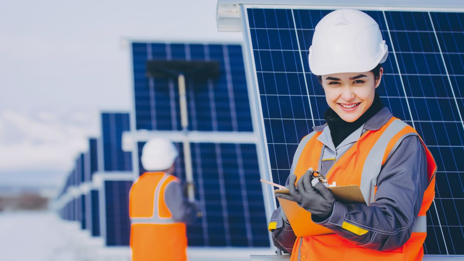 technicians cleaning solar panels