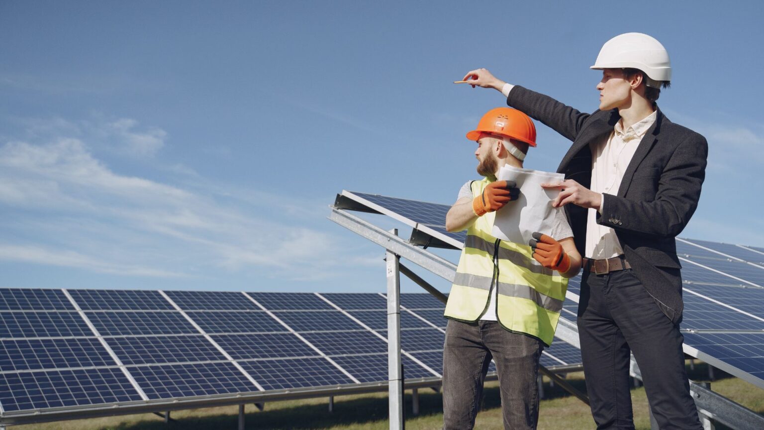 technicians looking at solar panels