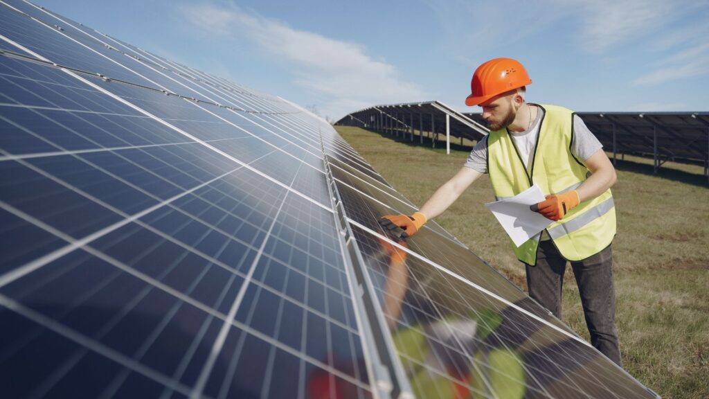 technician installing solar panels