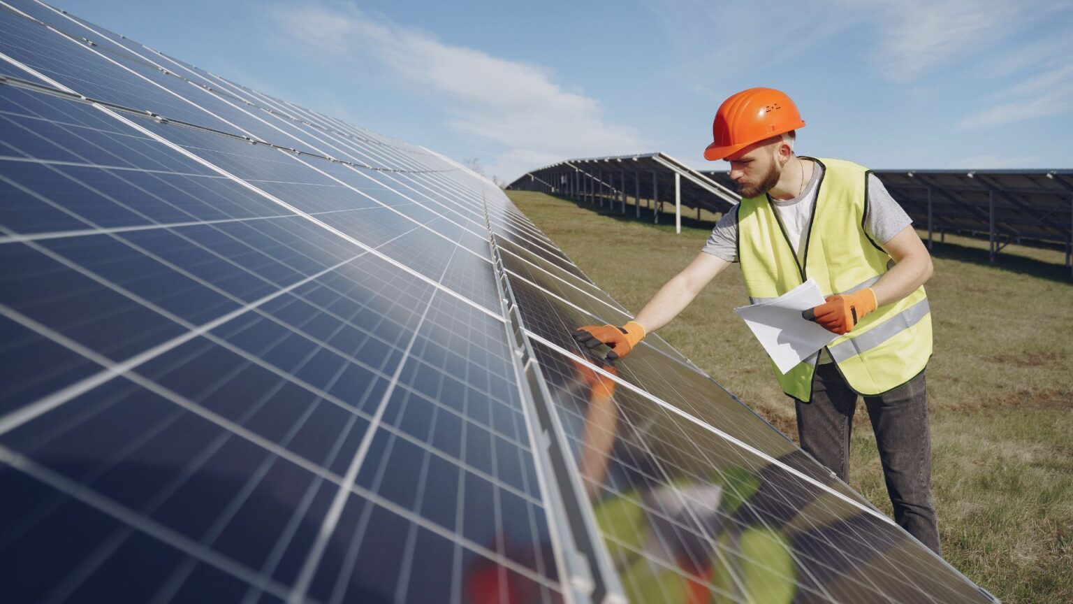 technician installing solar panels