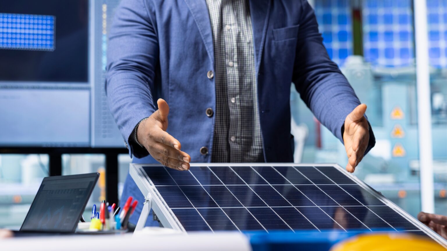 image of a man explaining a solar panel