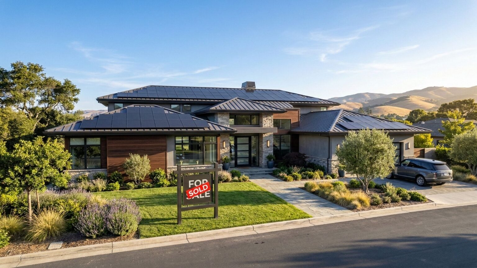 A luxury home in Brentwood, California with solar panels and a sold sign in the front yard.