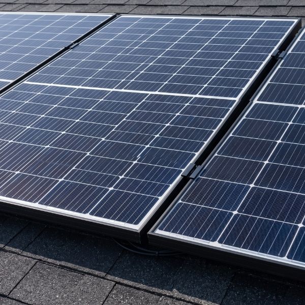 Close-up details of clean, high-efficiency solar panels expertly installed on a residential roof.